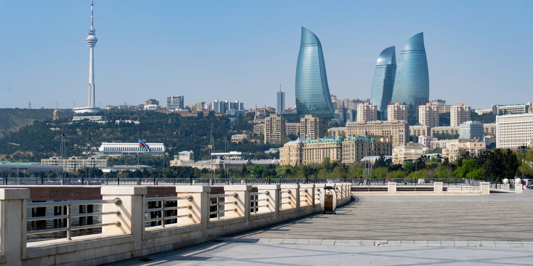 The Caspian seafront boulevard in Baku with the city skyline behind it